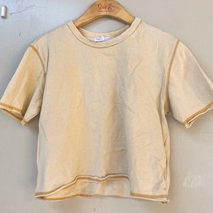 faded yellow tilly’s shirt